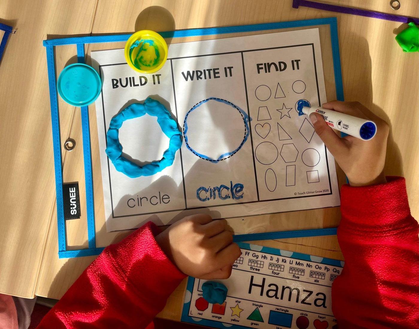 A student building, writing, and finding shapes